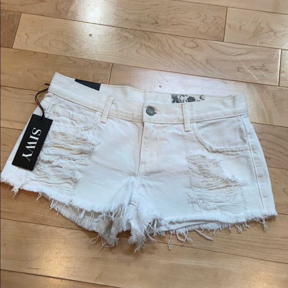 White distressed denim shorts
